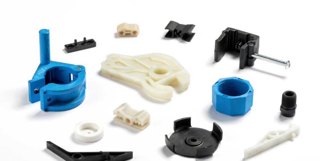 A wide variety of white, blue, and black plastic molded parts.